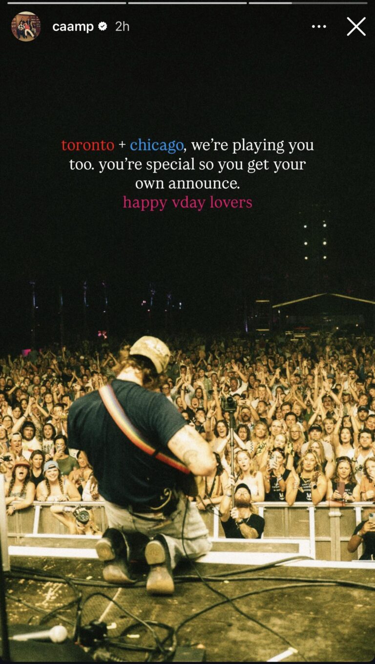Caamp Instagram story showing a back-facing guitarist kneeling onstage with a rainbow strap in front of a large, cheering festival crowd, and text above teasing "toronto + chicago, we’re playing you too... happy vday lovers.